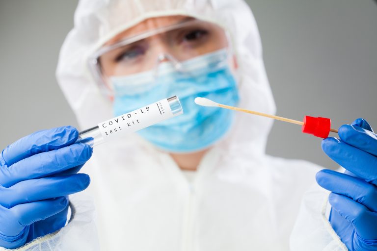 Medical,Healthcare,Nhs,Technician,Holding,Covid-19,Swab,Collection,Kit,wearing,White