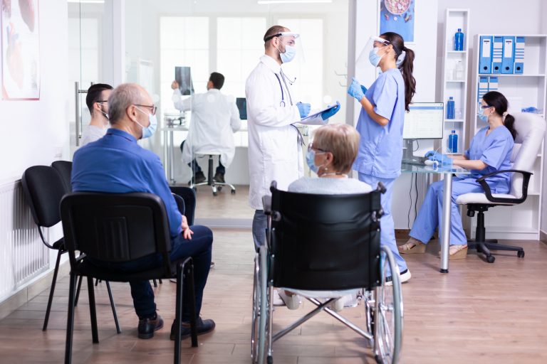 Medical,Team,With,Face,Mask,Against,Coronavirus,Discussing,About,Patient