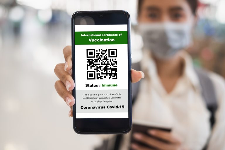 Traveler,Shows,Health,Passport,Of,Vaccination,Certification,On,Phone,At