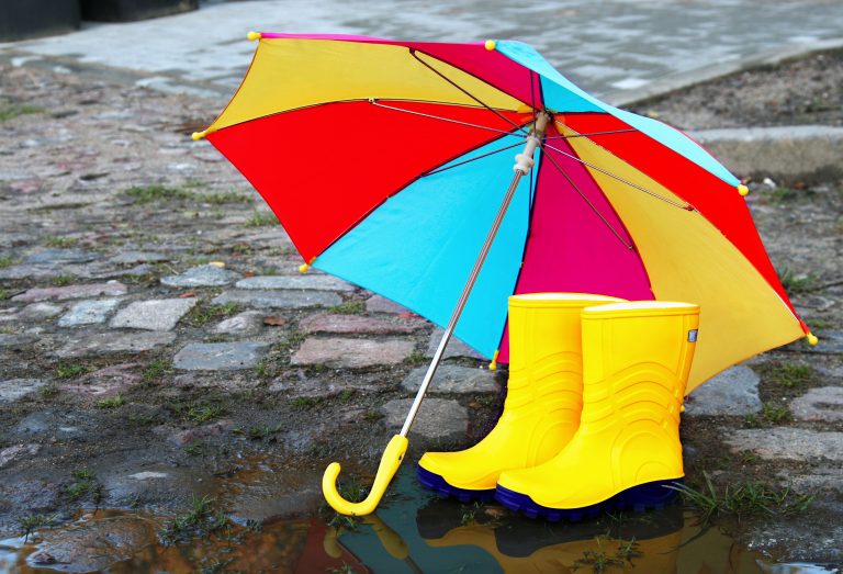 Pair,Of,Yellow,Rubber,Boots,With,An,Open,Umbrella,Beside