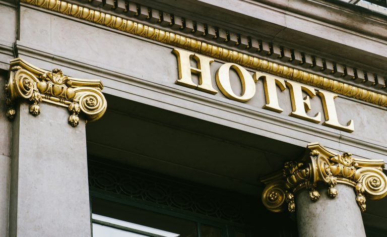 Hotel,Word,With,Golden,Letters,On,Luxury,Hotel,With,Beautiful