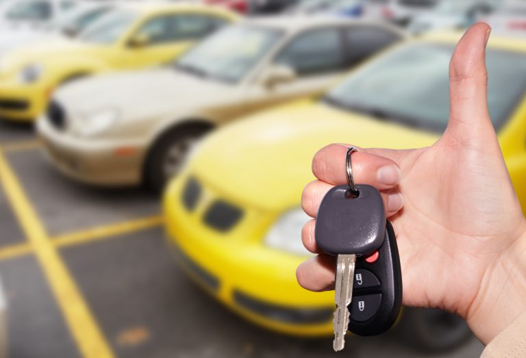 Dealer,Hand,With,A,Car,Key.