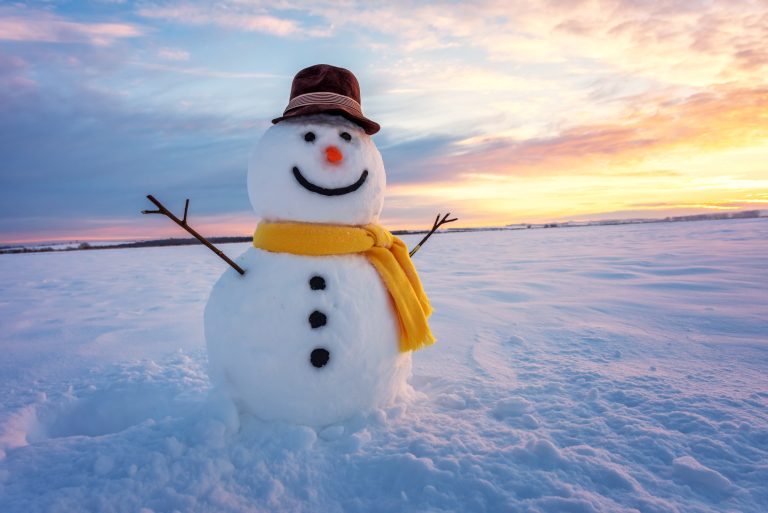 Snowman,On,Orange,Sunset,Background