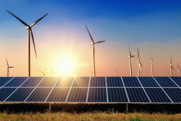 Solar,Panel,With,Turbine,And,Sunset,Blue,Sky,Background.,Concept