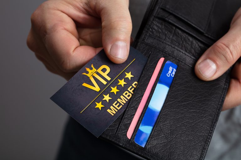Close-up,Of,A,Man,Hand,Removing,Vip,Member,Card,From