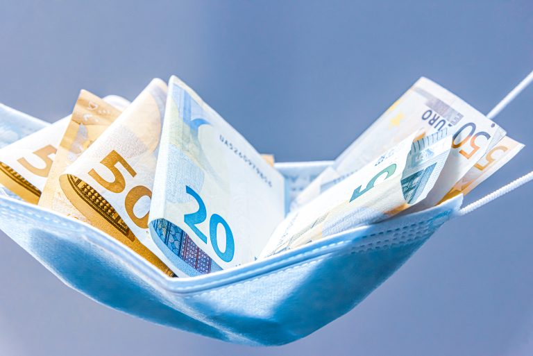 Medical,Face,Mask,Holding,Money,Inside,Of,It,,On,A