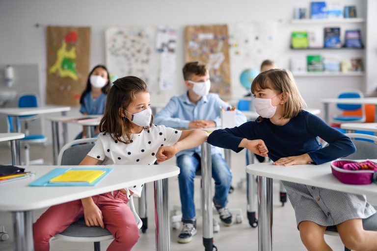 Children,With,Face,Mask,Back,At,School,After,Covid-19,Quarantine