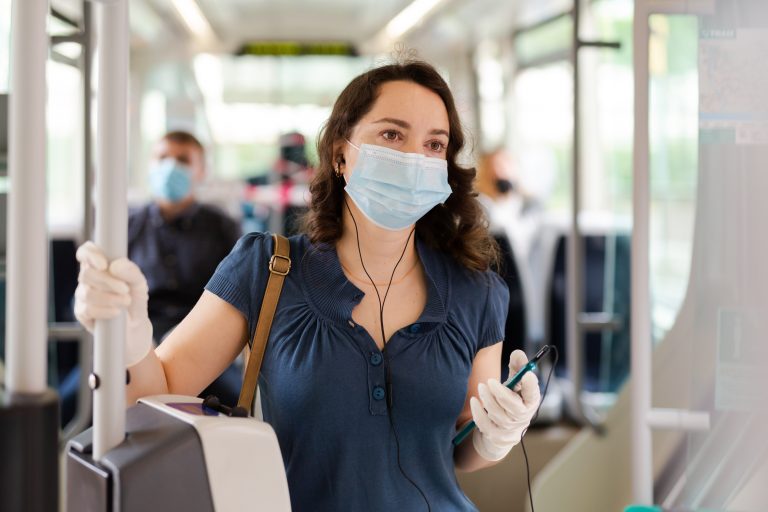 Portrait,Of,Female,Passenger,In,Disposable,Face,Mask,And,Latex