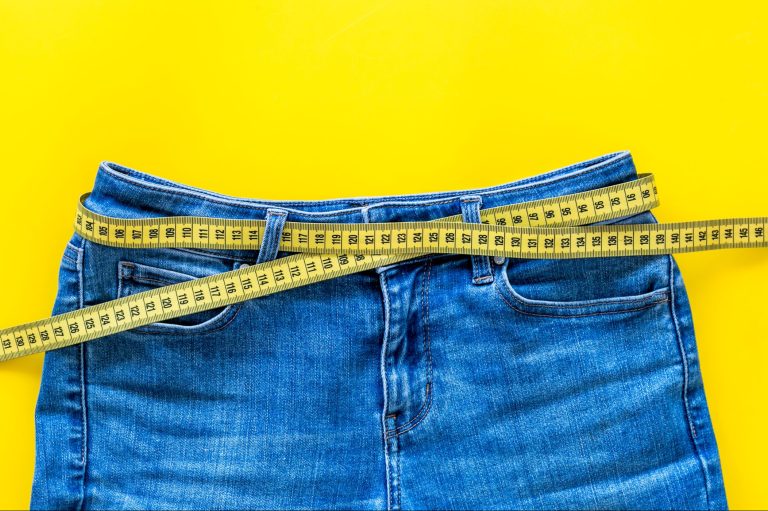 Weight,Loss,Concept,With,Pants,And,Measuring,Tape,On,Yellow