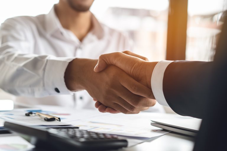 Banker,And,Client,Shaking,Hands,After,Business,Loan,Grant.