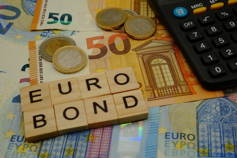 Some,Euro,Banknotes,And,Coins,With,A,Calculator,And,An