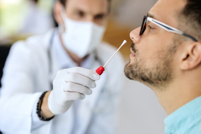 Close-up,Of,Young,Man,Getting,Pcr,Test,At,Doctor's,Office