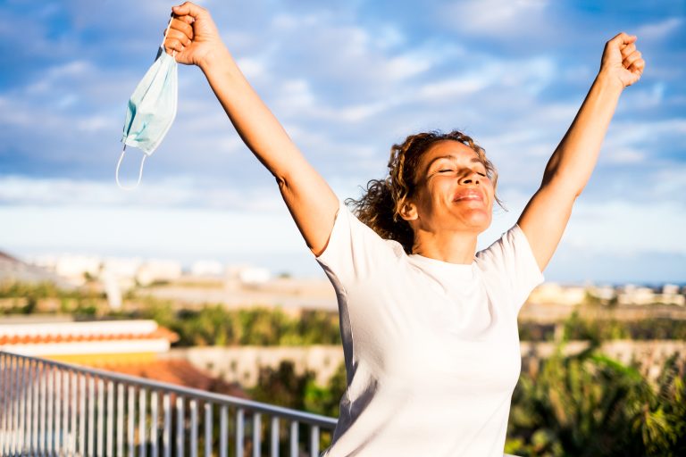One,Happy,Curly,Woman,Outdoors,In,Her,Balcon,Of,Her