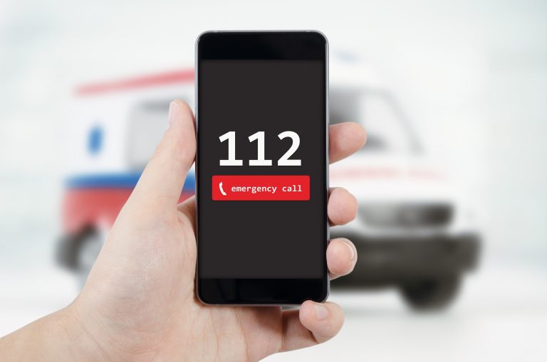 Man,Calling,Emergency.,Ambulance,In,Background.,Emergency,Call,112,Aid