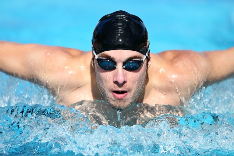 Swimmer.,Man,Swimming,Butterfly,Strokes,In,Competition.,Competitive,Male,Sport