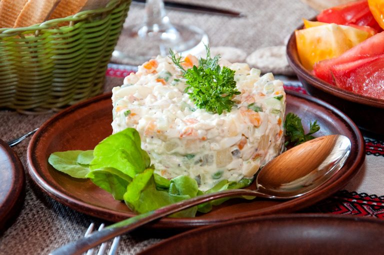 Salad,With,Meat,,Mayonnaise,,Cucumber,And,Potatoes.,Salad,Olivier,Decorated