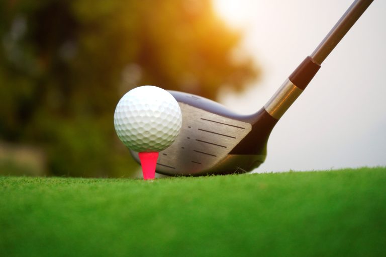 Blurred,Golf,Ball,And,Golf,Club,In,Beautiful,Golf,Course