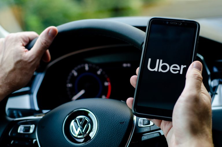 Soest,,Germany,-,August,4,,2019:,Uber,Driver,Holding,Smartphone