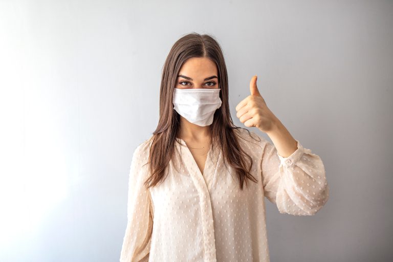 Young,Woman,Wearing,Medical,Face,Mask,,Studio,Portrait.,Woman,Wearing