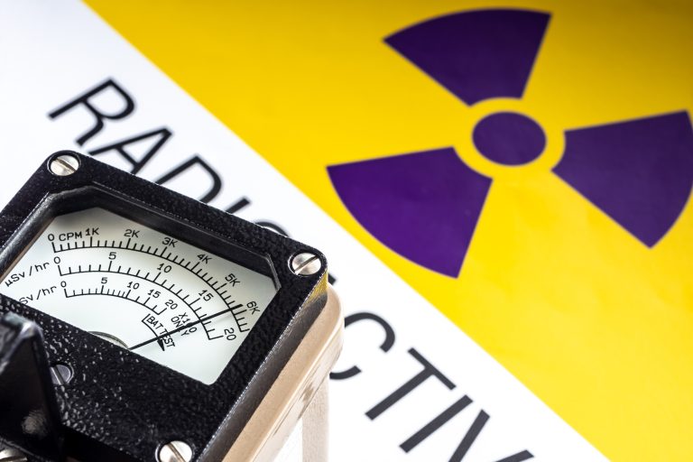 Hand-held,Radiation,Survey,Instrument,Detecting,At,The,Radioactive,Material,Symbol