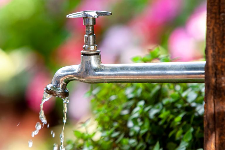 Dripping,Metallic,Tap,Open,At,The,Garden,With,Water,Falling
