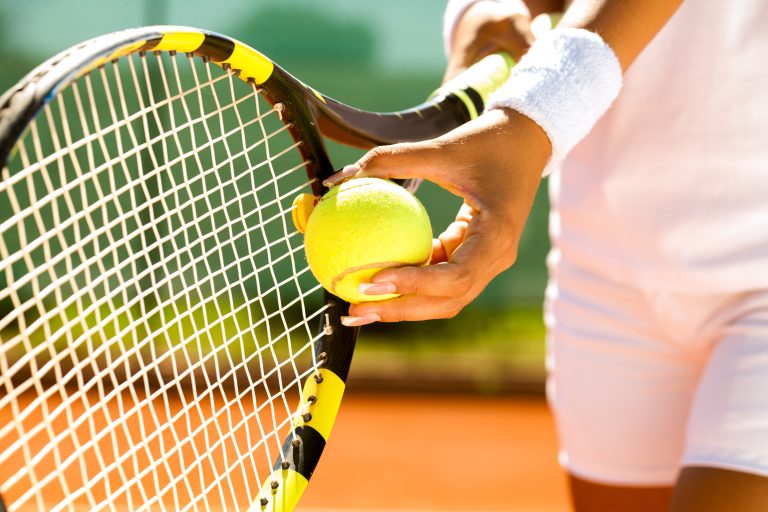 Player's,Hand,With,Tennis,Ball,Preparing,To,Serve