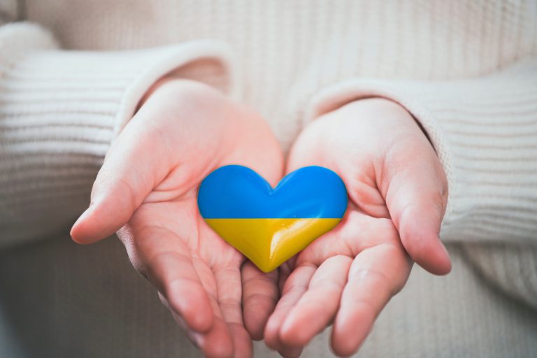 Child,Holding,Heart,In,Hand.,Concept,Of,Support,For,Ukrain