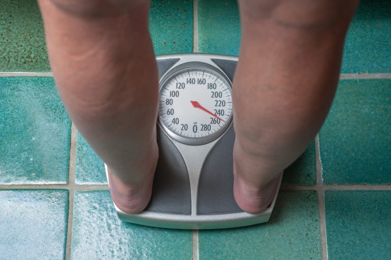 A,Severely,Overweight,Person,Weighing,Herself,Or,Himself,On,A