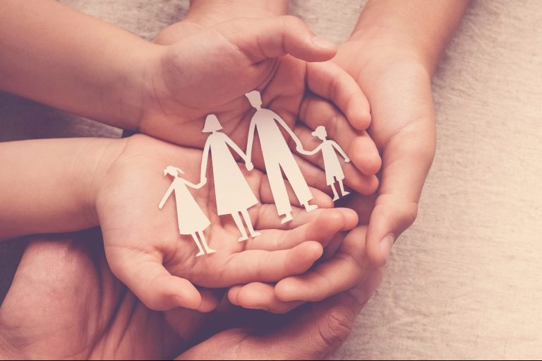 Hands,Holding,Paper,Family,Cutout,,Family,Home,,Foster,Care,,Homeless