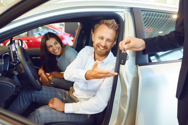 A,Happy,Couple,Bought,A,New,Car,At,A,Car