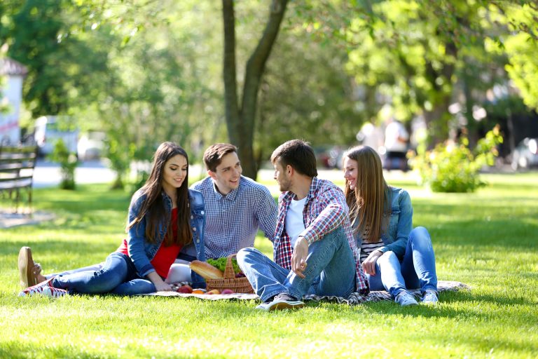 Happy,Friends,On,Picnic,In,Park