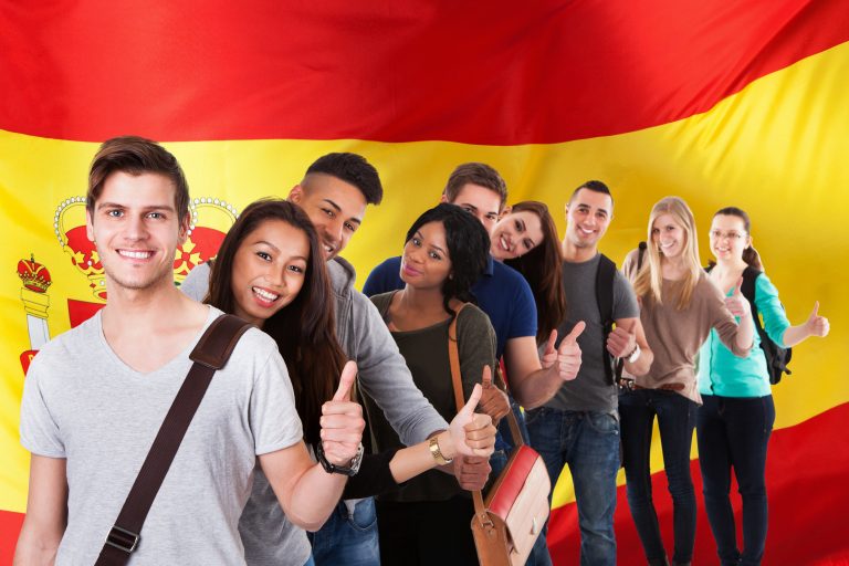 Group,Of,Happy,Multi,Ethnic,Students,Standing,In,Front,Of