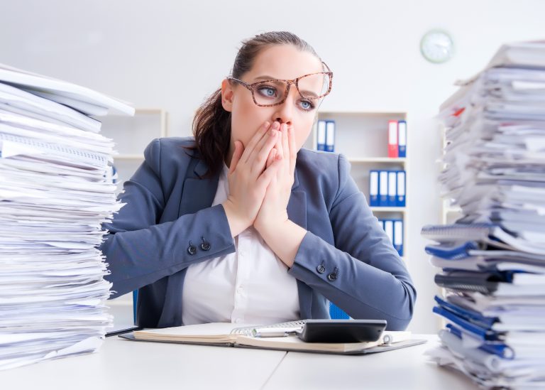 Tired,Businesswoman,With,Paperwork,Workload
