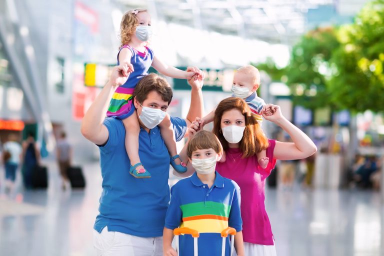 Family,In,Airport,In,Face,Mask.,Virus,Outbreak.,Coronavirus,And