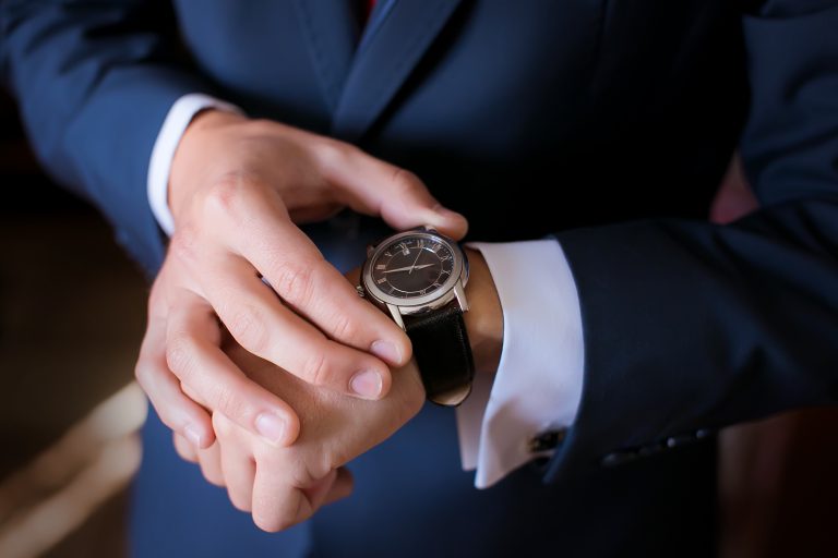 Hands,Of,Wedding,Groom,Getting,Ready,In,Suit