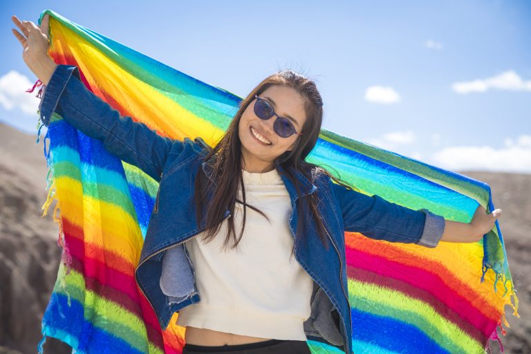 Beautiful,Young,Woman,With,Sunglasses,And,Colored,Fabric