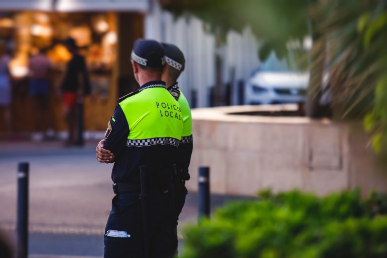 Spanish,Police,Squad,Formation,Back,View,With,"local,Police",Logo
