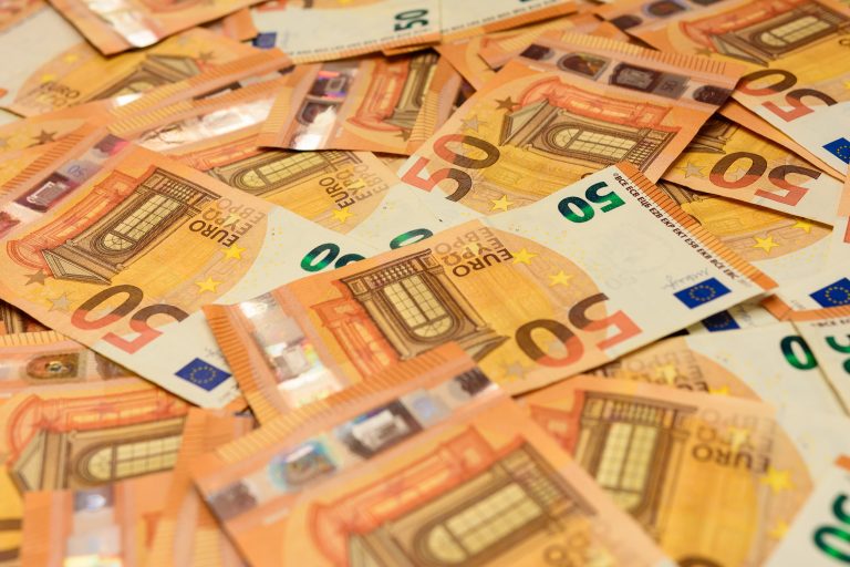 Banknotes,In,The,Denomination,Of,50,Euros,Are,Scattered,Randomly