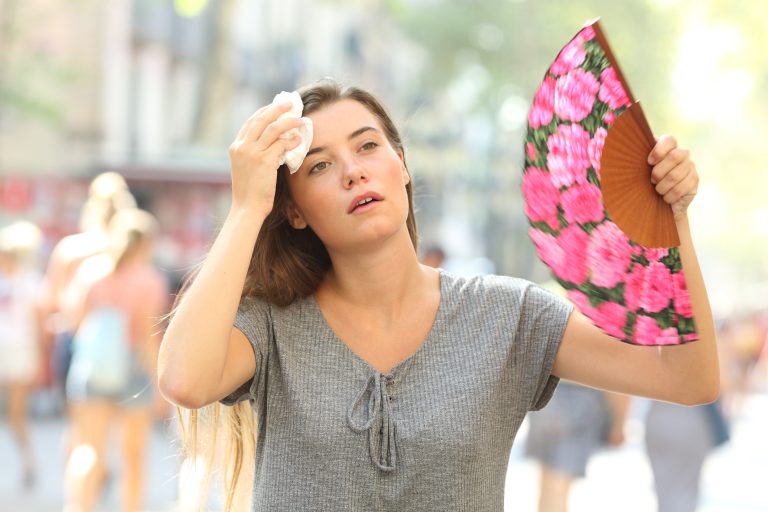 Front,View,Portrait,Of,A,Overwhelmed,Girl,Complaining,Suffering,Heat