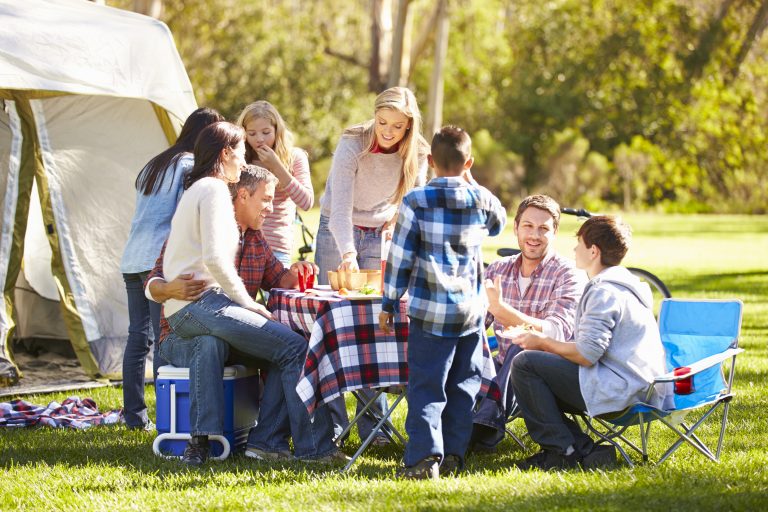 Two,Families,Enjoying,Camping,Holiday,In,Countryside