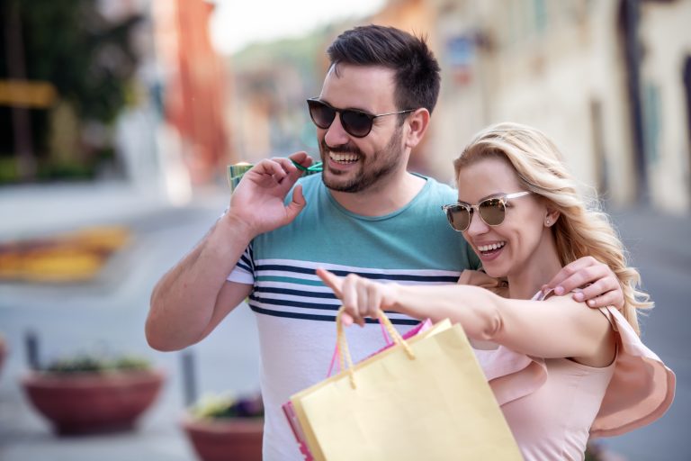 Portrait,Of,Happy,Couple,With,Shopping,Bags,After,Shopping,In