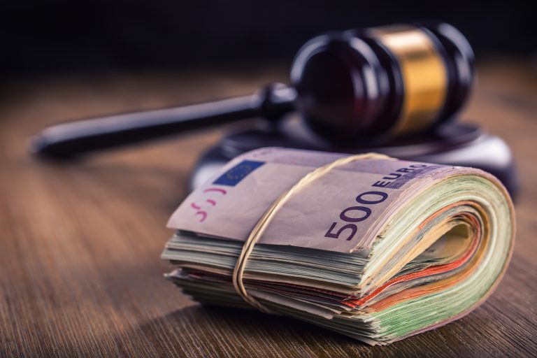 Judge's,Hammer,Gavel,And,Rolled,Euro,Banknotes.,Representation,Of,Corruption