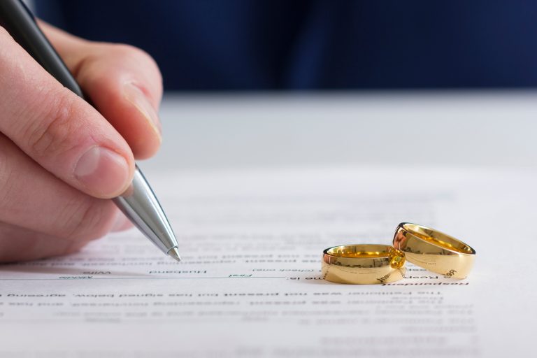 Hands,Of,Wife,,Husband,Signing,Decree,Of,Divorce,,Dissolution,,Canceling