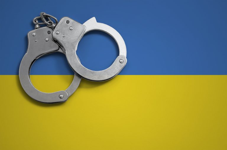 Ukraine,Flag,And,Police,Handcuffs.,The,Concept,Of,Crime,And