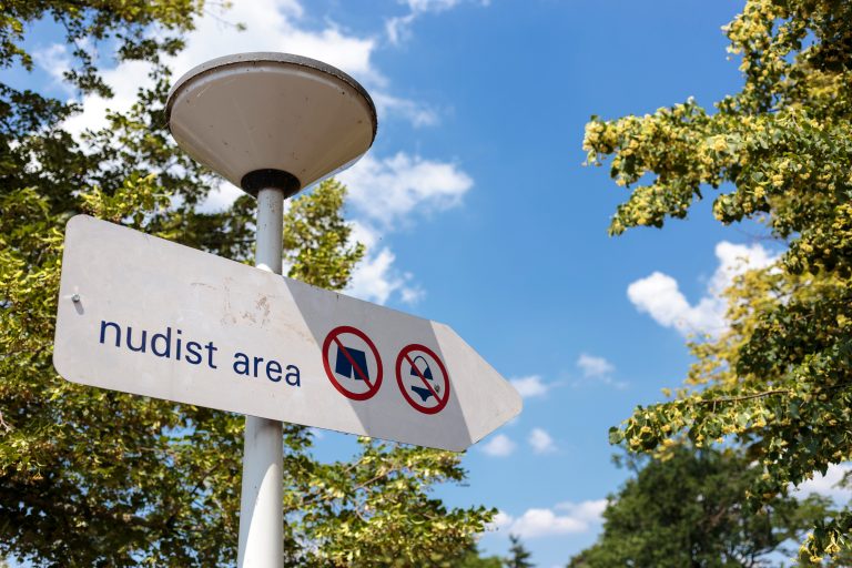 Information,Sign,Indicating,Designated,Area,For,Nude,Sunbathing.,Nudist,Area