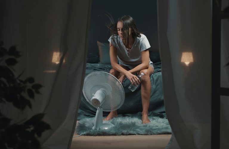 Exhausted,Woman,Suffering,Suring,The,Heatwave,,She,Is,Holding,A