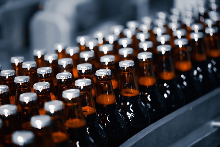 Beer,Bottles,On,A,Conveyor,Belt.,Industrial,Beer,Production