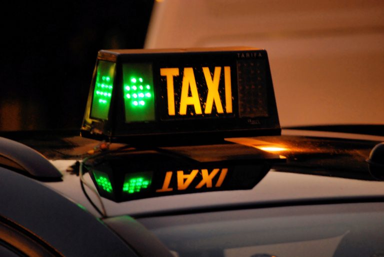 Shone,Sign,On,A,Night,Taxi,In,Barcelona