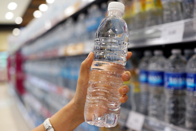 Close,Up,Female,Hand,Holding,A,Bottle,Of,Water,Or