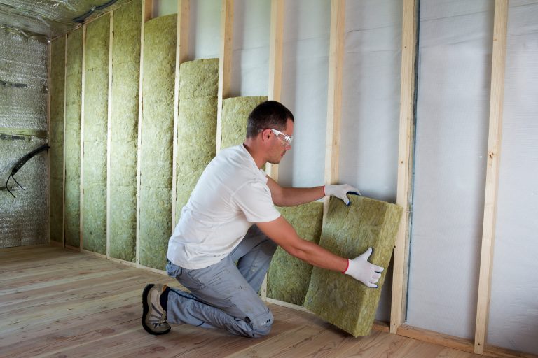 Worker,In,Protective,Goggles,And,Respirator,Insulating,Rock,Wool,Insulation